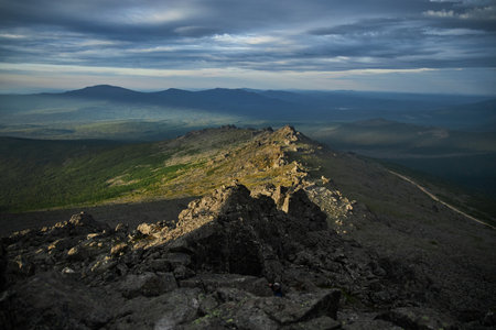 Severe weather in the Ural Mountains, Russia. Fog creeps down the mountainside, cold summerの写真素材