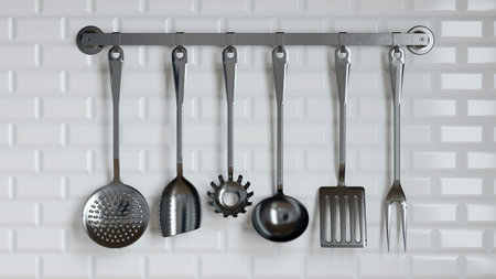 collection of sleek metal kitchen utensils is displayed on a rack against a textured white wall, showcasing various tools used for cooking and food preparation. 3d renderの写真素材