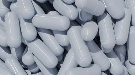 Gray capsules are arranged in a close-up view. They are piled on a flat surface, showing a variety of positions and orientations. scene highlights the shapes and sizes of the capsules. 3d render.の写真素材