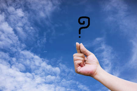 Hand holding a question markの写真素材