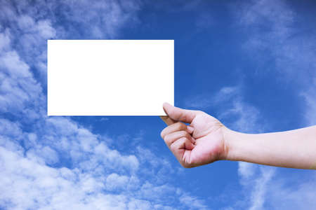 Hand holding a blank paperの写真素材