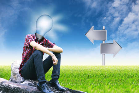 	The sun in lamp man and empty signposts on landscapes background