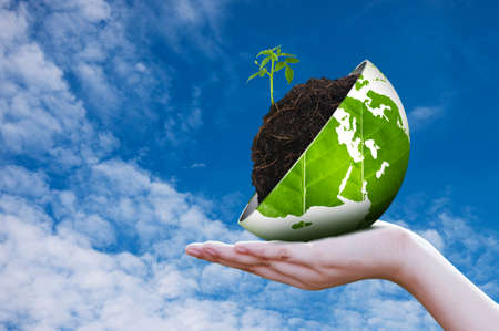 Eco world on hand sky backgroundの写真素材