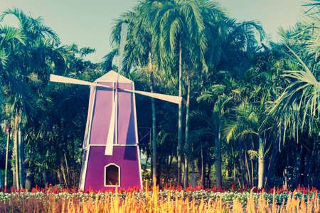 Wind turbines and flower in the gardenの写真素材