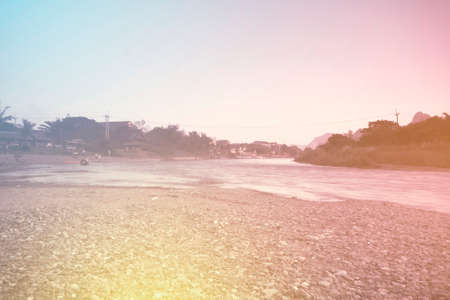 Colorful landscapes river and yallow boat in Vang Vieng Laos, Colorful styleの写真素材