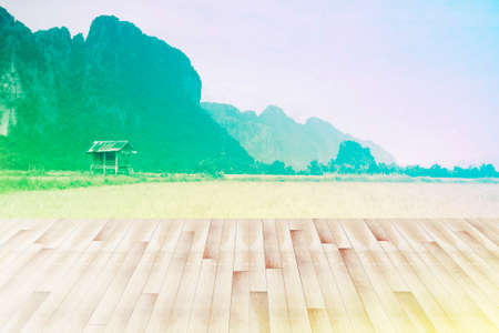 wood terrace with landscape background. Colorful vintage styleの写真素材