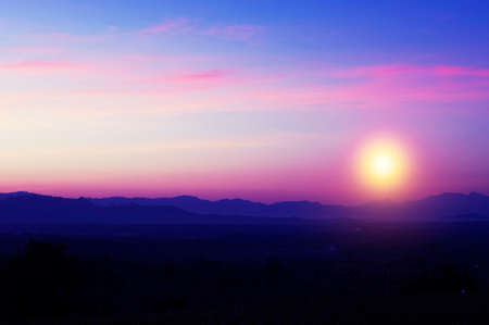 Beautiful silhouette landscape and sunset at night on a meadow on early winter at moon