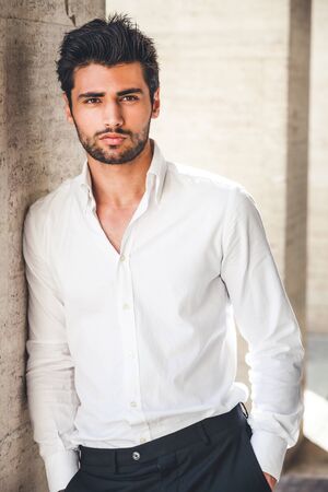 Handsome and stylish young man with white shirt. Stubble beard.の写真素材