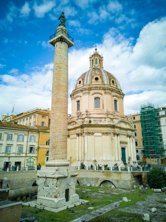 Rome, Italy. October 31, 2018: The Church of the Most Holy Name of Mary at the Trajan Forum and the Trajan's Column. Roman triumphal column in Rome, Italy, that commemorates Roman emperor Trajan.のeditorial素材