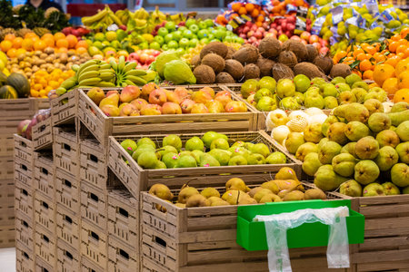Rome, Italy. December 05, 2018: Fruit and vegetable department with numerous varieties of fruit exposed inside a MA supermarket in Italy in Rome. Crates of fruit and vegetables in a large space.のeditorial素材