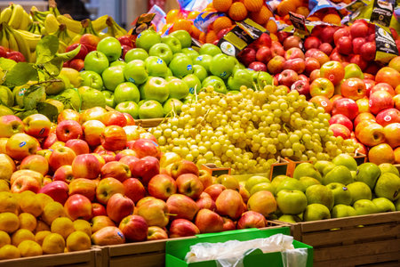 Rome, Italy. December 05, 2018: Fruit and vegetable department with numerous varieties of fruit exposed inside a MA supermarket in Italy in Rome. Crates of fruit and vegetables in a large space.のeditorial素材