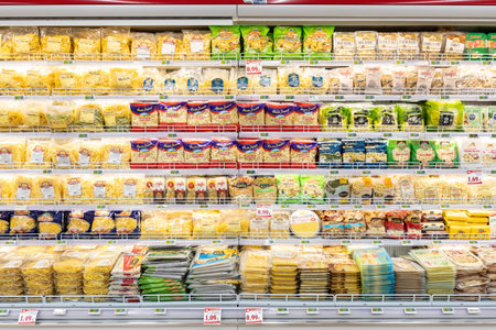 Rome, Italy. December 05, 2018: Dairy department, yogurt and milk-derived cheeses products inside a MA supermarket in Italy in Rome. Long refrigerator with a large variety of products.のeditorial素材