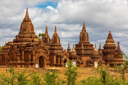 Buddhist pagoda temple. Bagan, Myanmar. Home of the largest and denset concentration of religion Buddhist temples, pagodas, stupas and ruins in the world. Sky with clouds.の写真素材
