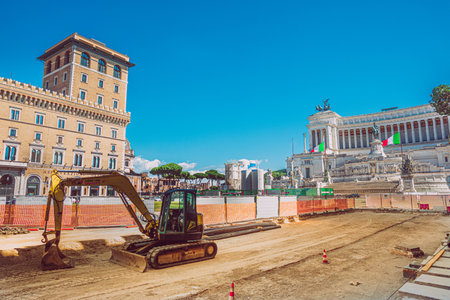 Rome, Italy. May 25, 2020: Rome subways in Italy under construction in the historic center of the capital of Italy. Construction site open for the construction of new metro stops in Rome. Piazza di Spagna with altar of the fatherland on the background.のeditorial素材