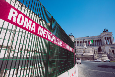 Rome, Italy. May 25, 2020: Rome subways in Italy under construction in the historic center of the capital of Italy. Construction site open for the construction of new metro stops in Rome. Piazza di Spagna with altar of the fatherland on the background.のeditorial素材