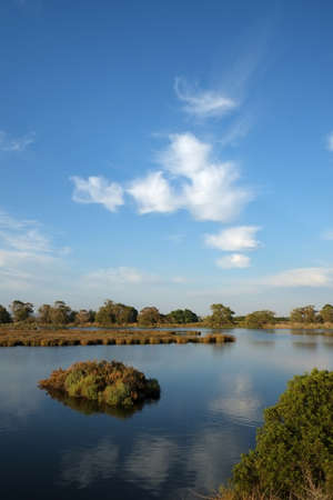 Cloud reflections on riverの写真素材