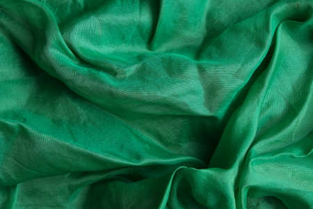 Smooth and shiny green silk handkerchiefの写真素材