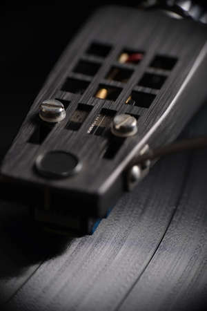 Close up magnification of a vinyl record playing. Front view