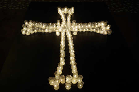 Cross made with candles. Religion and spiritualityの写真素材