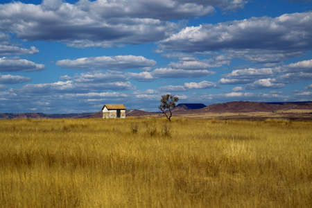 an isolated house on the moors on a cloudyの写真素材