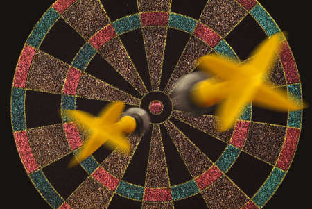 Two darts flying to target