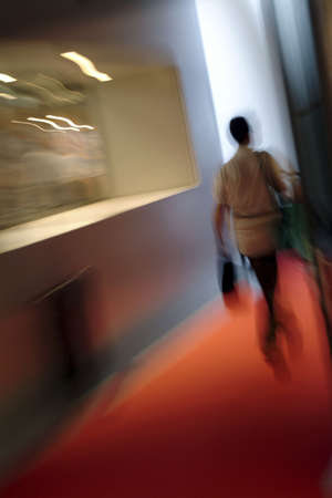 Woman walking indoor - movementの写真素材
