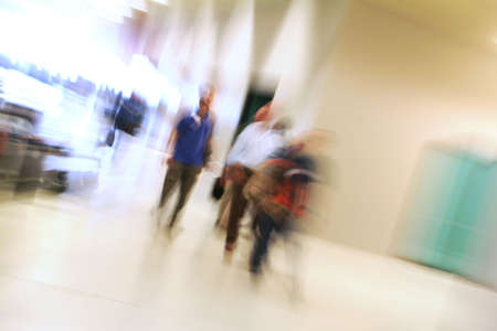 People walking indoor - blurの写真素材
