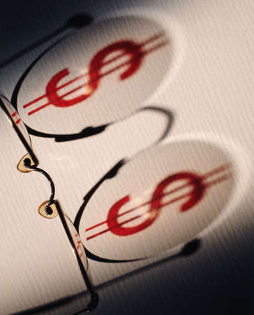 Dollar symbol on glasses shadowの写真素材