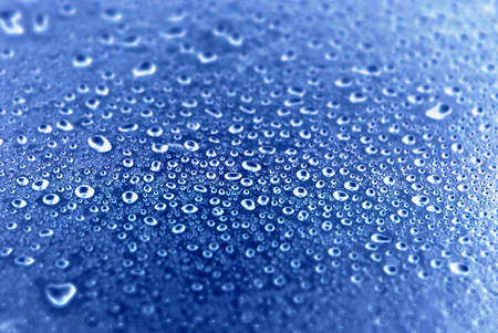 Water drops over blue