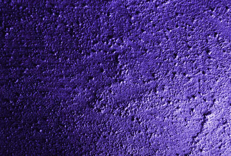 Rough concrete surface - blue lightの写真素材