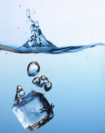 ice cube splashing in the water, close upの写真素材