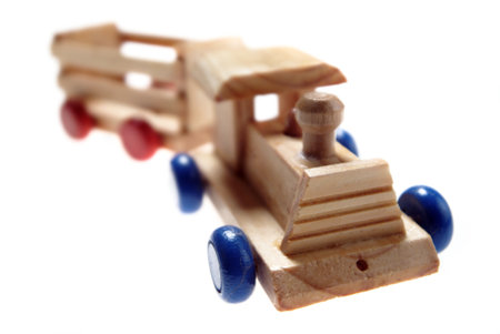 Wooden toy train isolated on white background. Selective focus.の写真素材