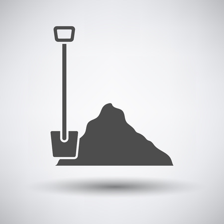 Construction shovel and sand icon on gray background with round shadow.のイラスト素材
