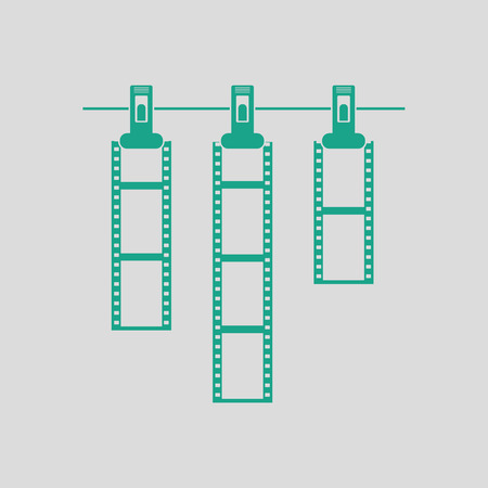 Icon of photo film drying on rope with clothespin. Gray background with green. Vector illustration.のイラスト素材