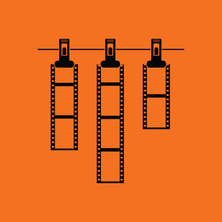 Icon of photo film drying on rope with clothespin. Orange background with black. Vector illustration.のイラスト素材