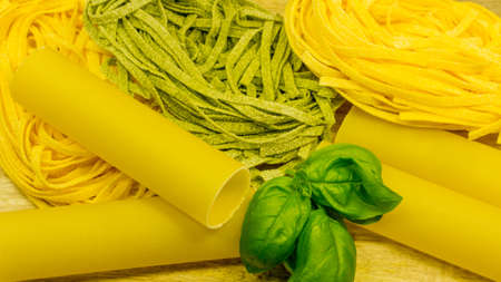 Pasta with fresh red tomatoes and basil. Italian food ingredientsの写真素材