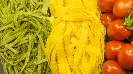 Pasta with fresh red tomatoes and basil. Italian food ingredientsの写真素材