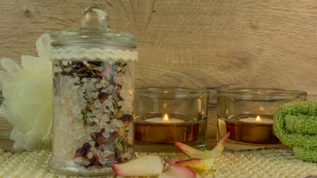 Spa and wellness with bath salt, candles and rose blossomの写真素材