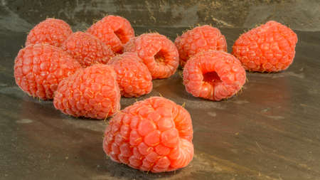 Raspberries on a background of slate