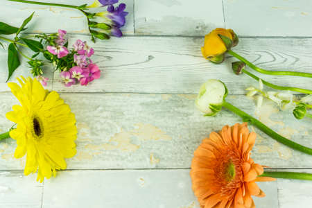 Colorful bouquet on a white rustic wooden backgroundの写真素材