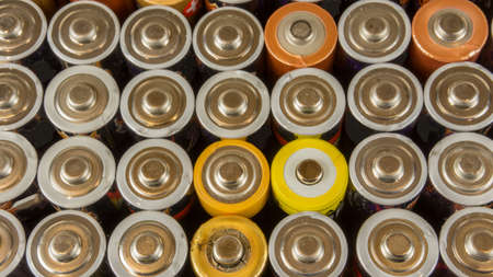 Old batteries for recycling in different colorsの写真素材