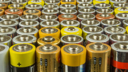 Old batteries for recycling in different colorsの写真素材