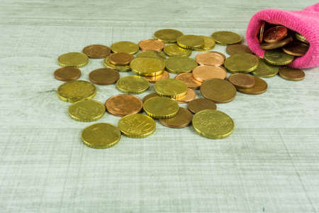 Money socks as piggybank on a wooden tableの写真素材