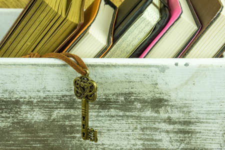 Many books in a wooden box on a rustic undergroundの写真素材