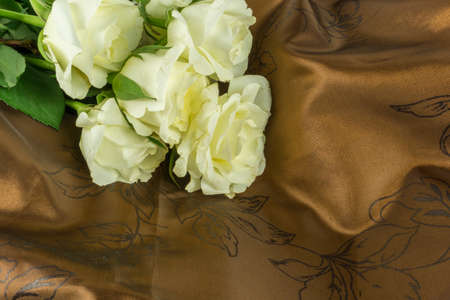 White roses on a fabric floorの写真素材