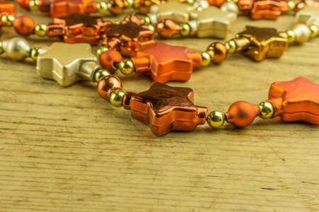 Christmas decoration with star garlands on a rustic boardの写真素材