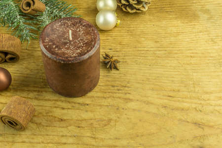 Christmas decoration with Christmas balls, aniseed, cinnamon and candlesの写真素材