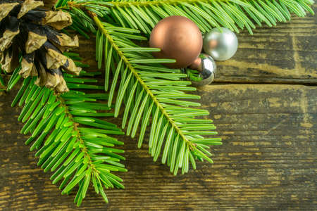 Christmas decoration with Christmas balls and branches of a fir treeの写真素材