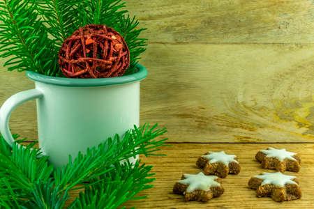 Christmas decoration with coffee cup and cinnamon starsの写真素材
