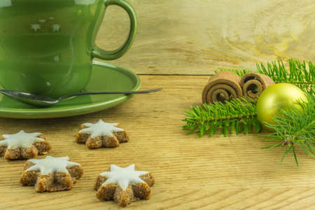 Christmas decoration with coffee cup and cinnamon starsの写真素材